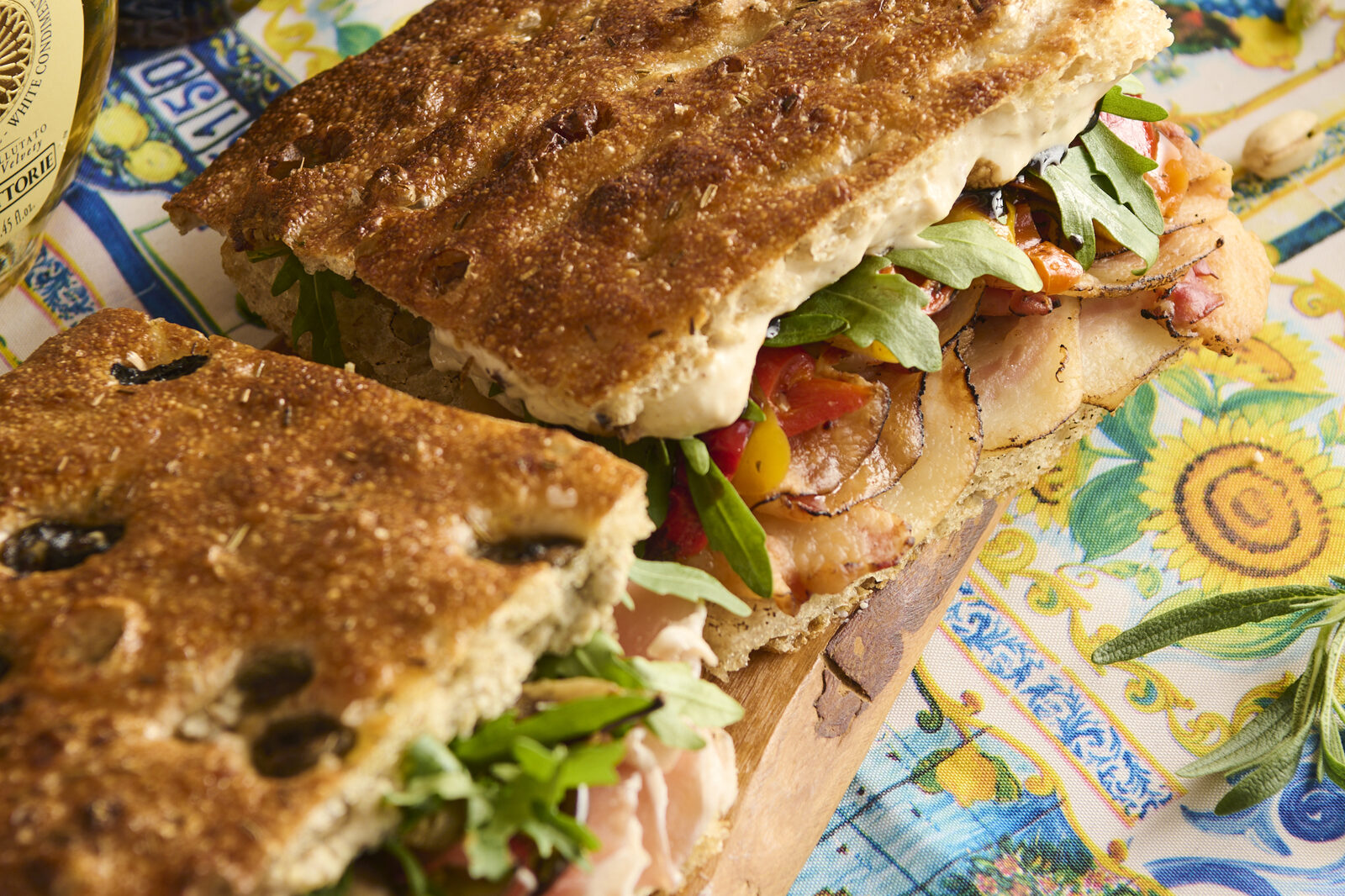 La Posata focaccia sandwiches on a Sicilian majolica tablecloth